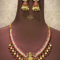 Antique Kundan Necklace features Goddess Lakshmi at the center with real pearls and paired with kundan and real pearl drop jhumkas