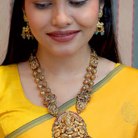 Antique Nakshi Kundan necklace detailed Lakshmi pendant with elegant pumpkin beads and matching nakshi kundan jhumkas