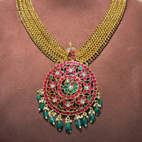 Antique kundan pendant with pearl beads made paired with parrot jhumkas handcrafted with 92.5 silver with intricate detailing.