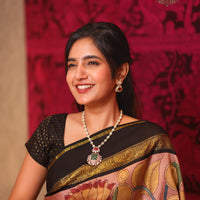 semi precious uncut polki necklace with onyx beads, russian emeralds and ruby paired with stunning earrings made with 92.5 silver