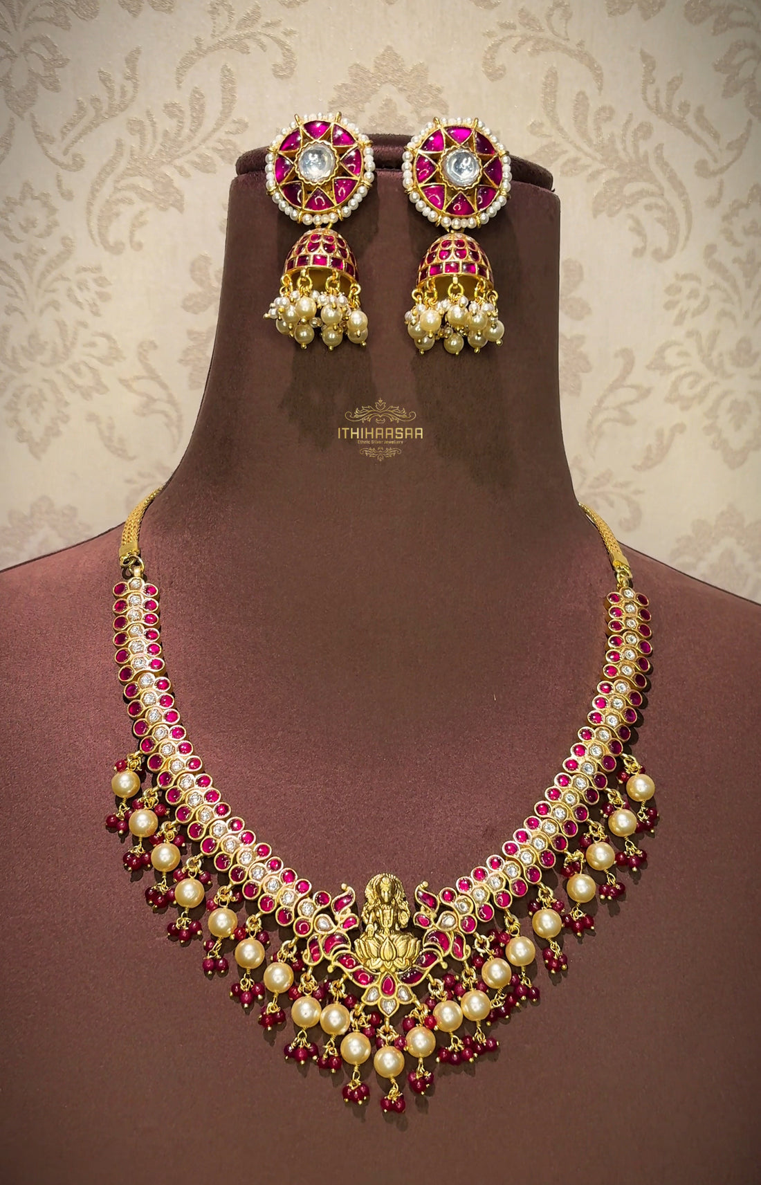 Antique Kundan Necklace features Goddess Lakshmi at the center with real pearls and paired with kundan and real pearl drop jhumkas
