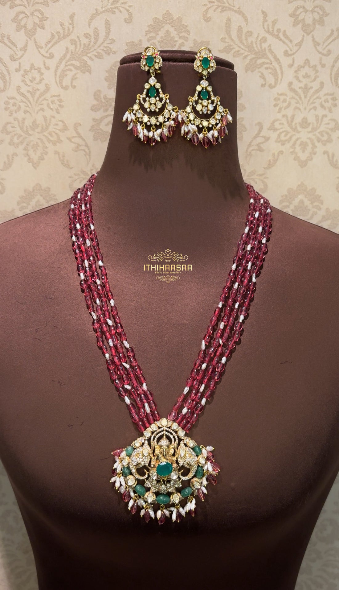  Real Pearls and Semiprecious Tourmaline beads with a sacred Ganesha pendant crafted in semi-precious Uncut Polkis and emerald stones. Paired with Uncut polki emerald Long earrings