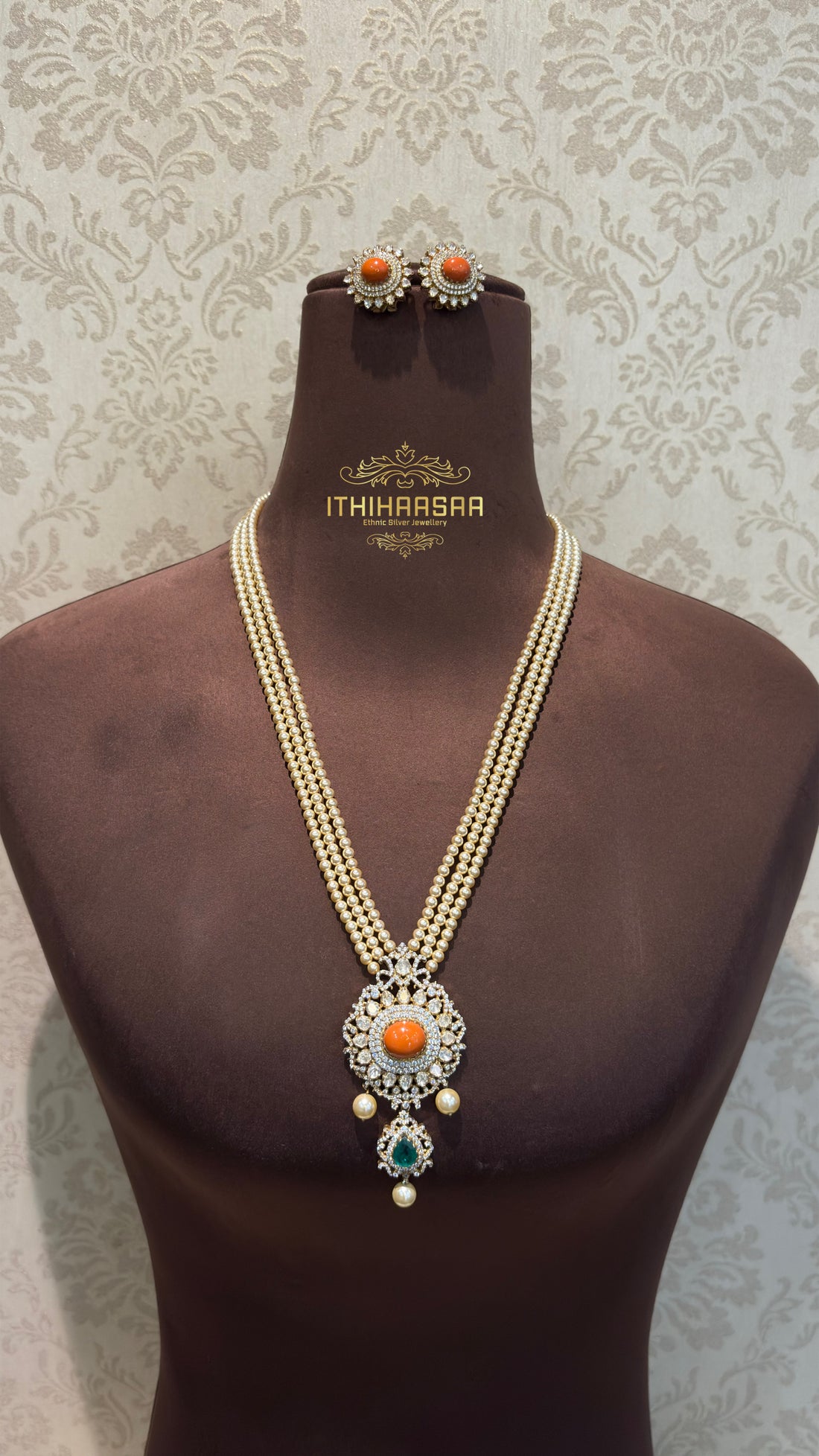 Real pearls beautifully complemented with Real Taiwanese Coral stone. Paired with Coral stud earrings with 92.5 Silver