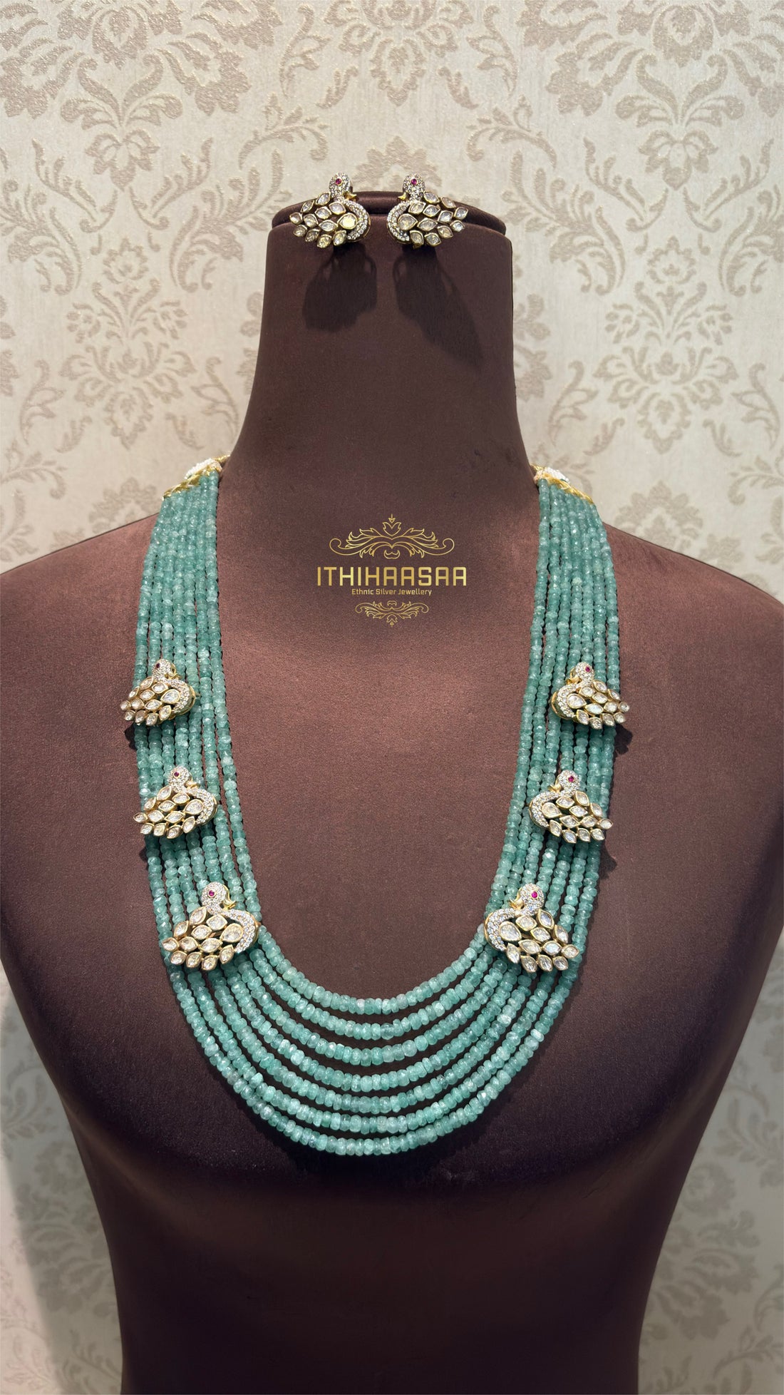 Layered Aventurine beads with intricate Swan motifs paired with Uncut Polki  stud made with 9.5 silver