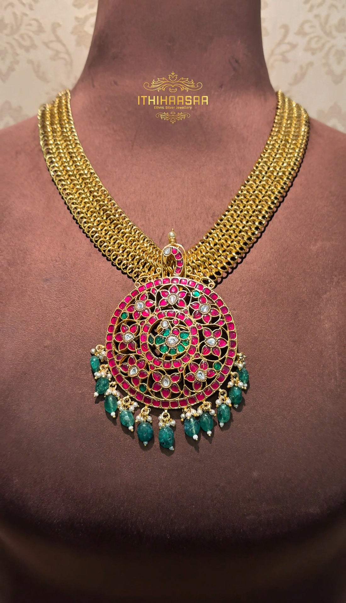 Antique kundan pendant with pearl beads made paired with parrot jhumkas handcrafted with 92.5 silver with intricate detailing.