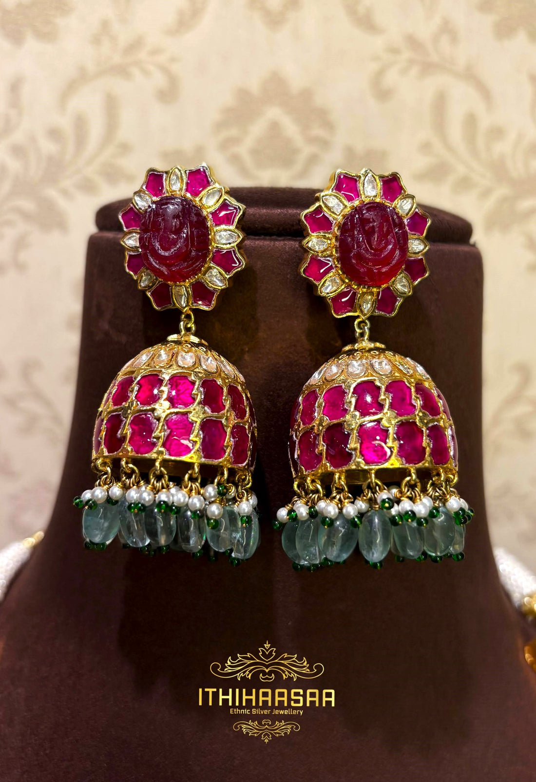 Statement navarathan jhumkas in kundan stones made with 92.5 silver and 24ct gold plated.